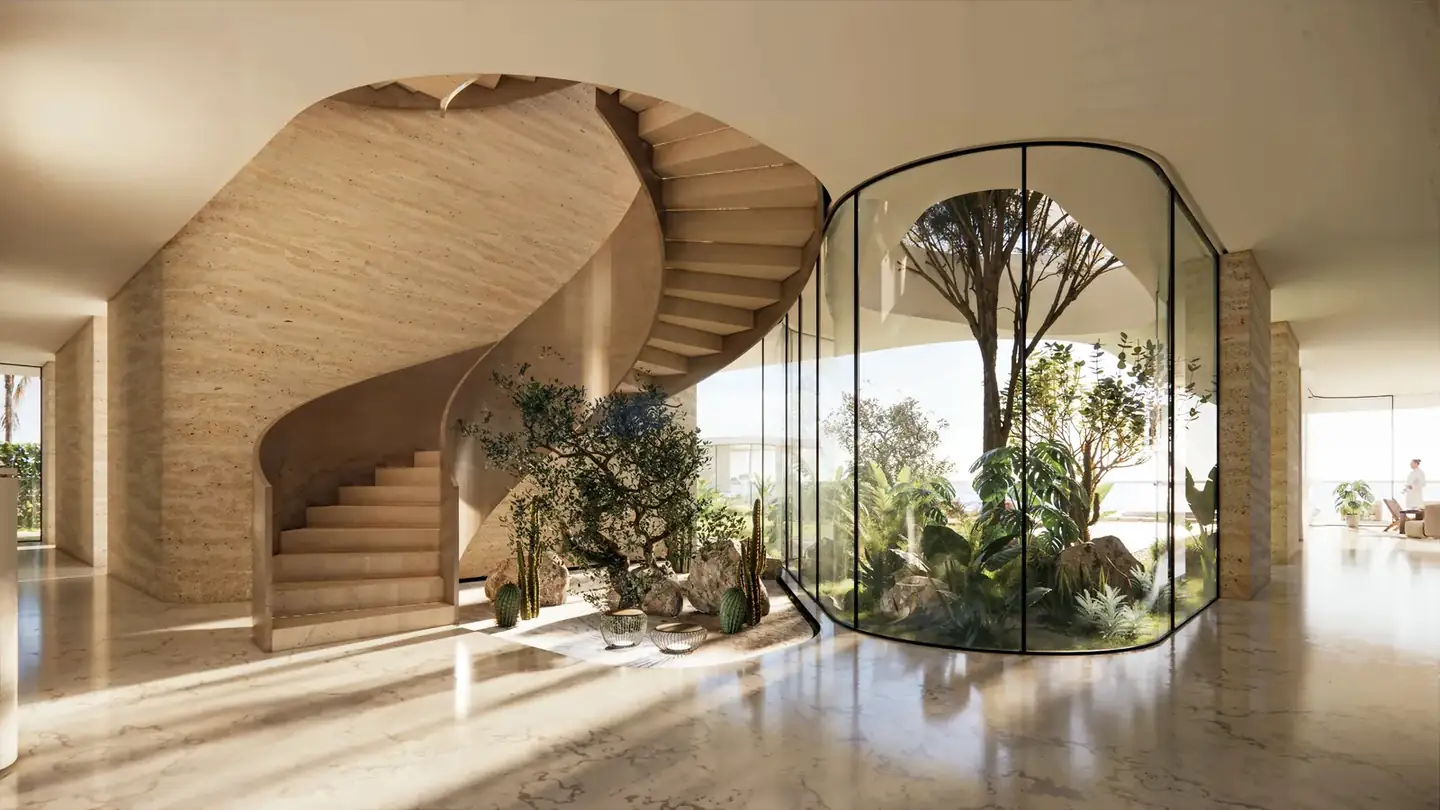 Sculpted stair beside a glazed garden court